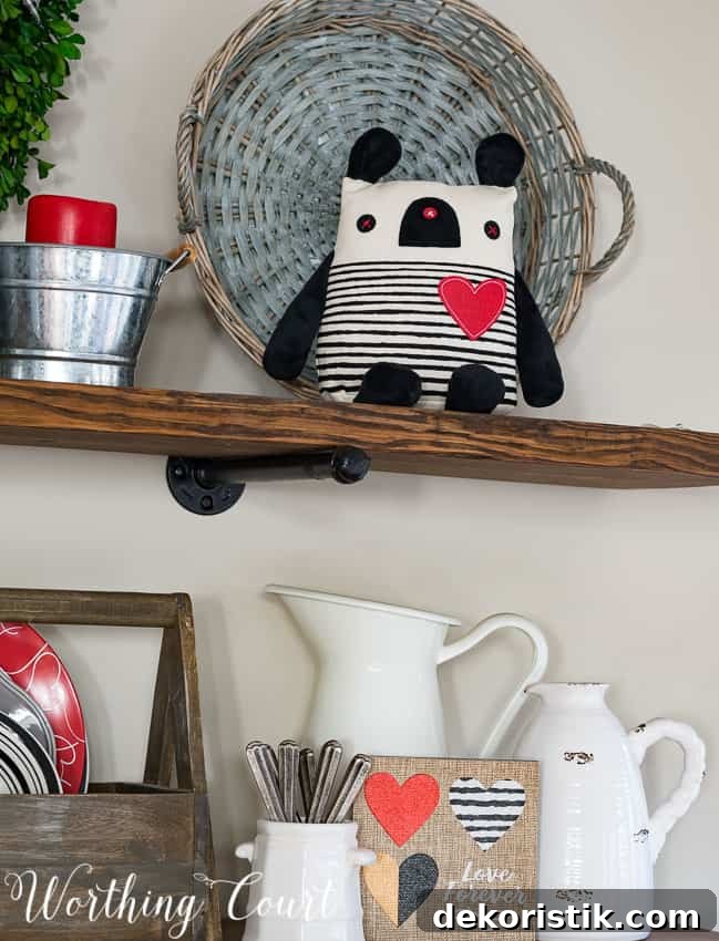 A little stuffed animal is on the open shelf.
