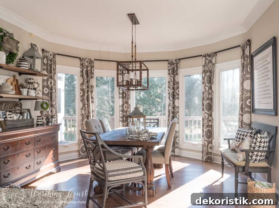 Farmhouse Breakfast Nook Transformation: Before and After 15 A wooden table, wooden hutch and large windows with window coverings on it.