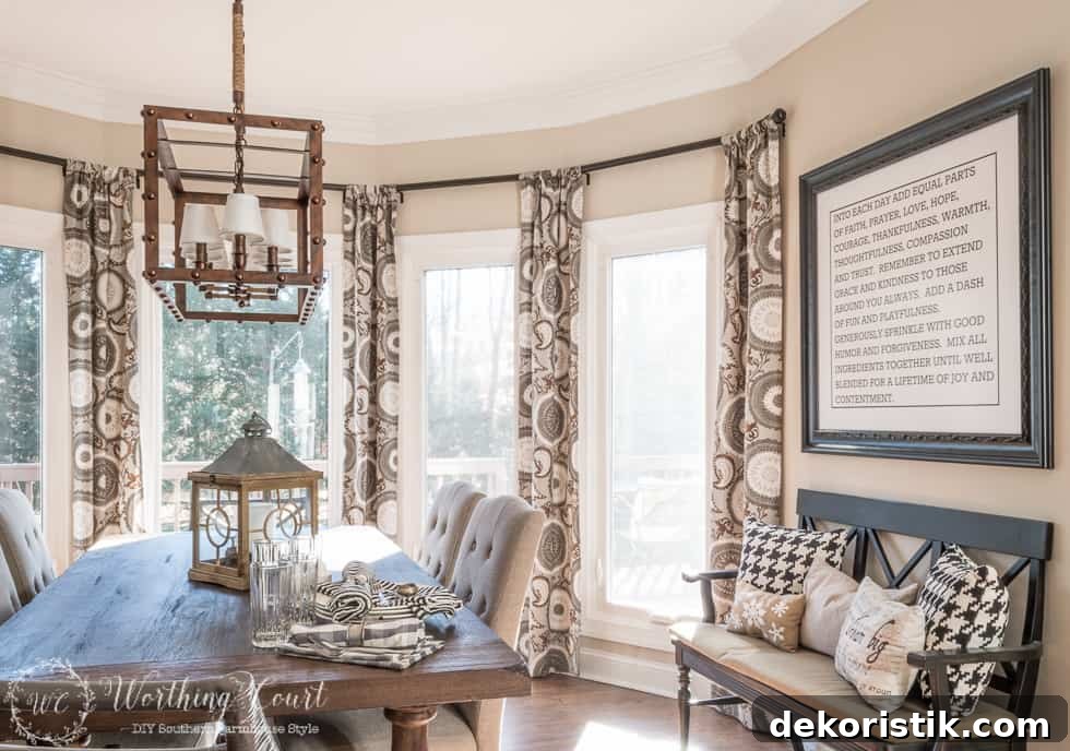 There is a small bench to the side with throw pillows on it.