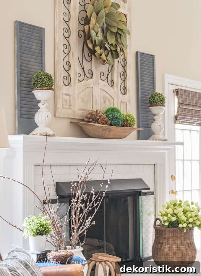 Farmhouse style white painted brick fireplace and mantel decorated for spring || Worthing Court