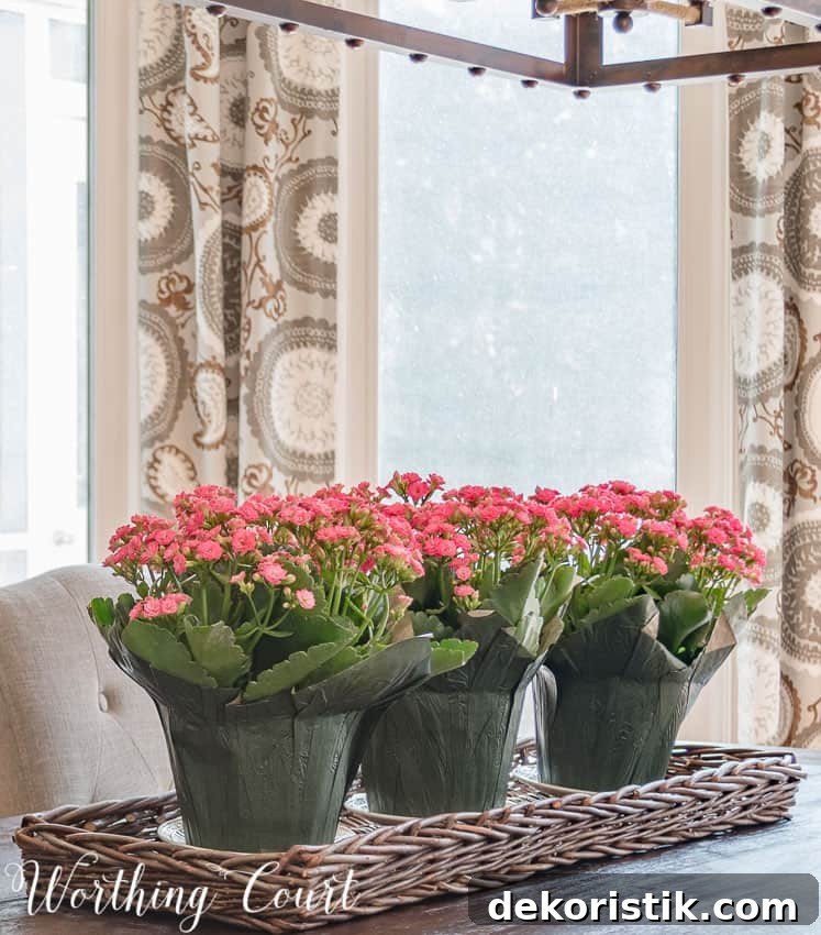 Use potted flowers in a wicker tray for a super simple spring centerpiece || Worthing Court