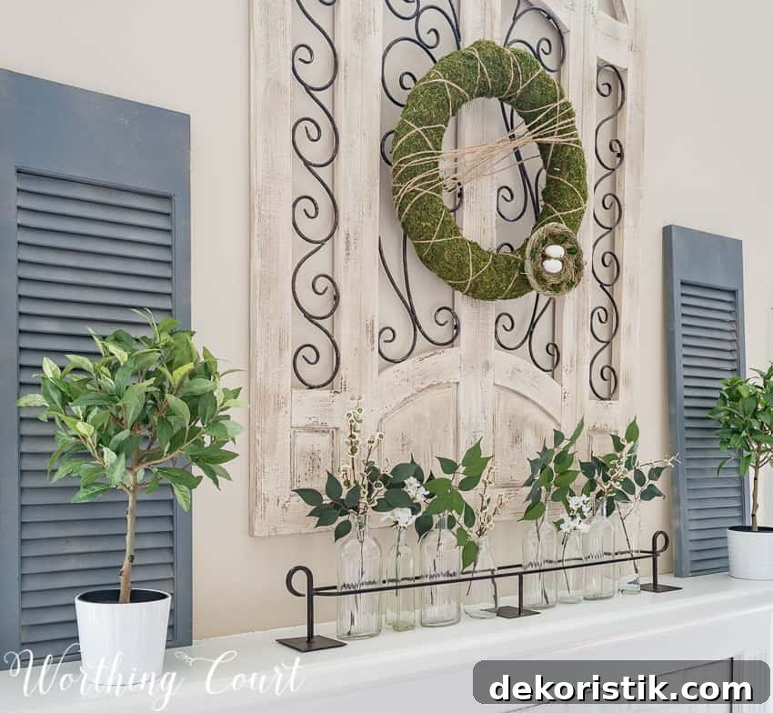 Simple faux greenery in glass bottles make easy spring decor || Worthing Court