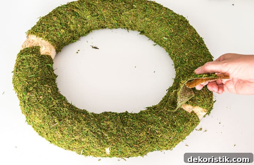Making sure all the spots are covered with the moss.