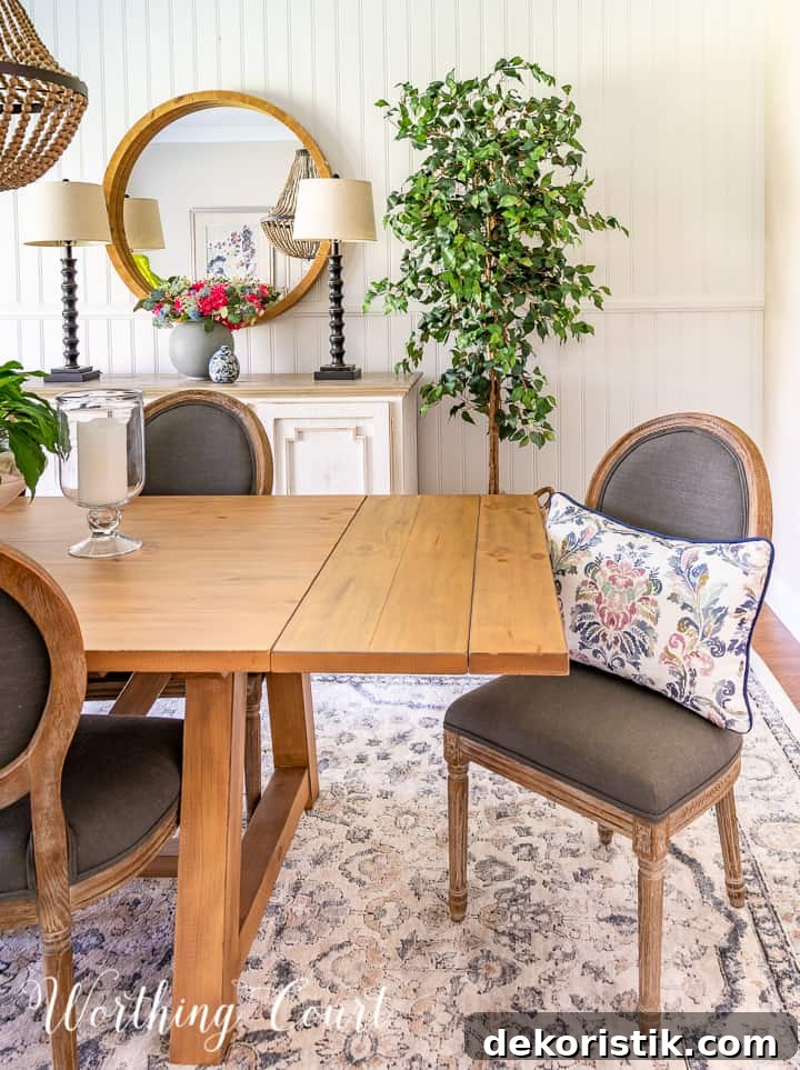gray chair at end of dining table
