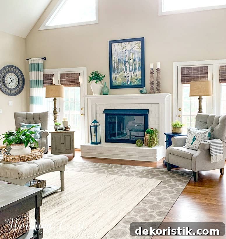family room with white brick fireplace flanked by gray recliners