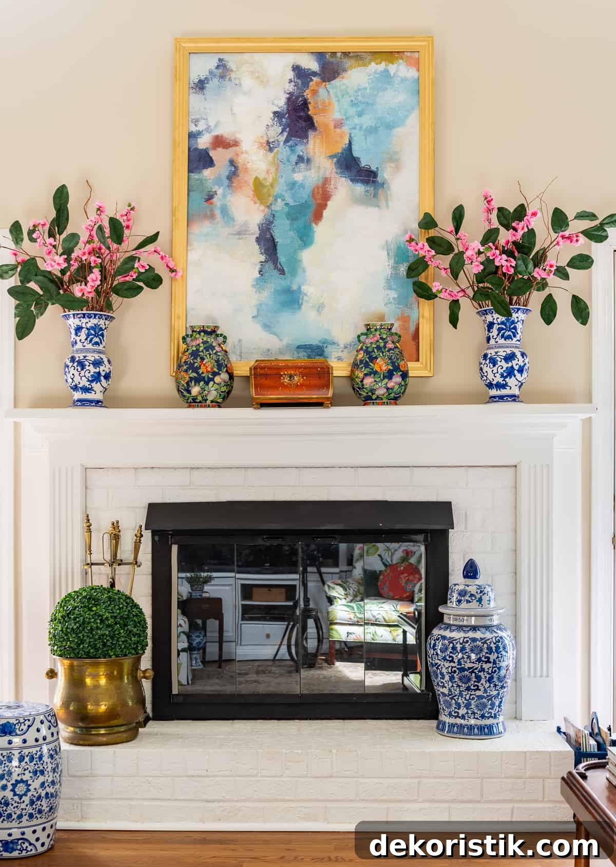 fireplace in a living room decorated in new traditional style with blue recliners, wood tables, colorful accessories and a faux antelope area rug