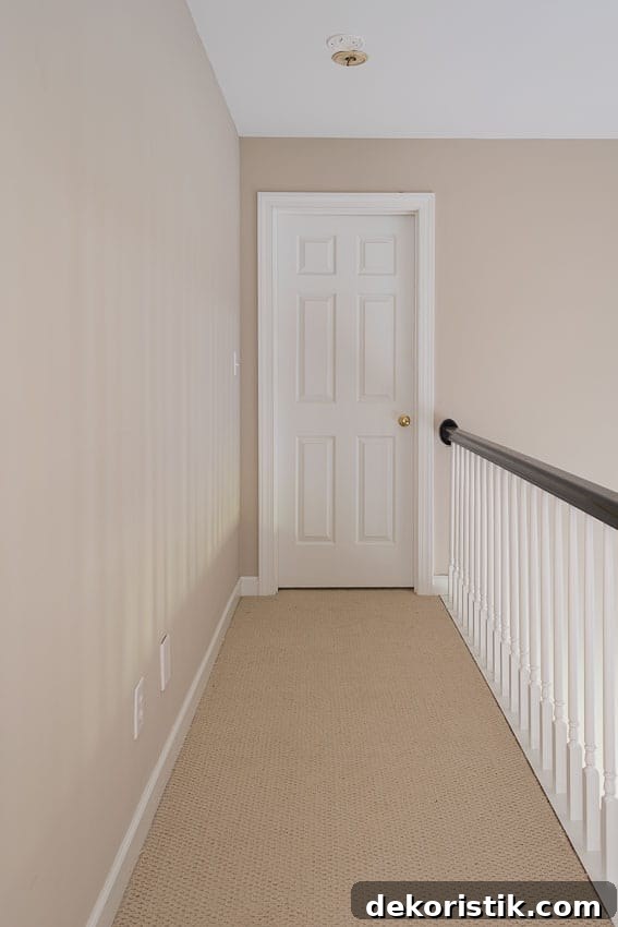 The top of the stairs long narrow hallway.
