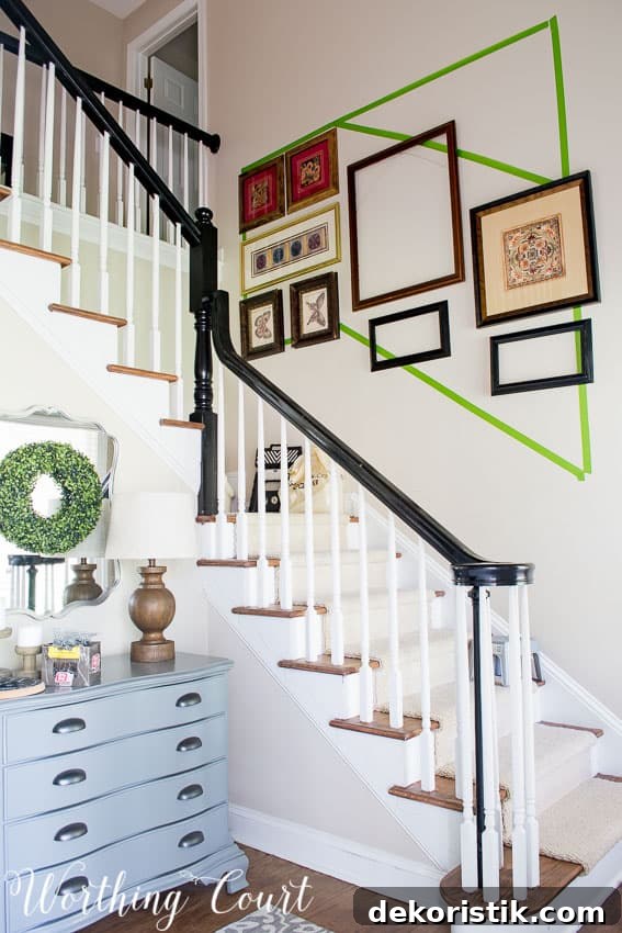 Gallery Wall Ideas for Staircases 5 Using old frames to figure the layout for a stairway gallery wall.