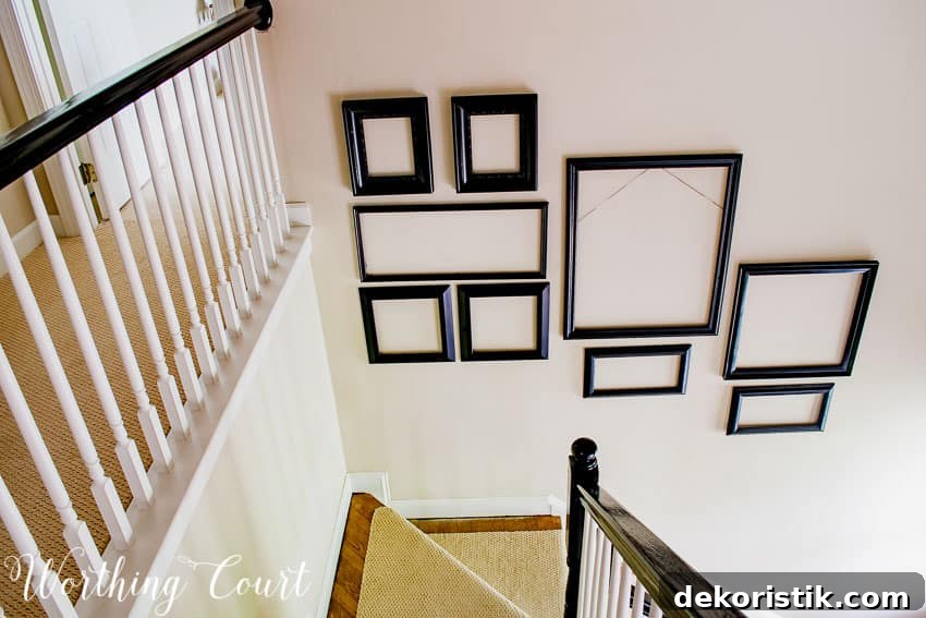 Gallery Wall Ideas for Staircases 7 Two story stairway gallery wall frame arrangement going up the wall.