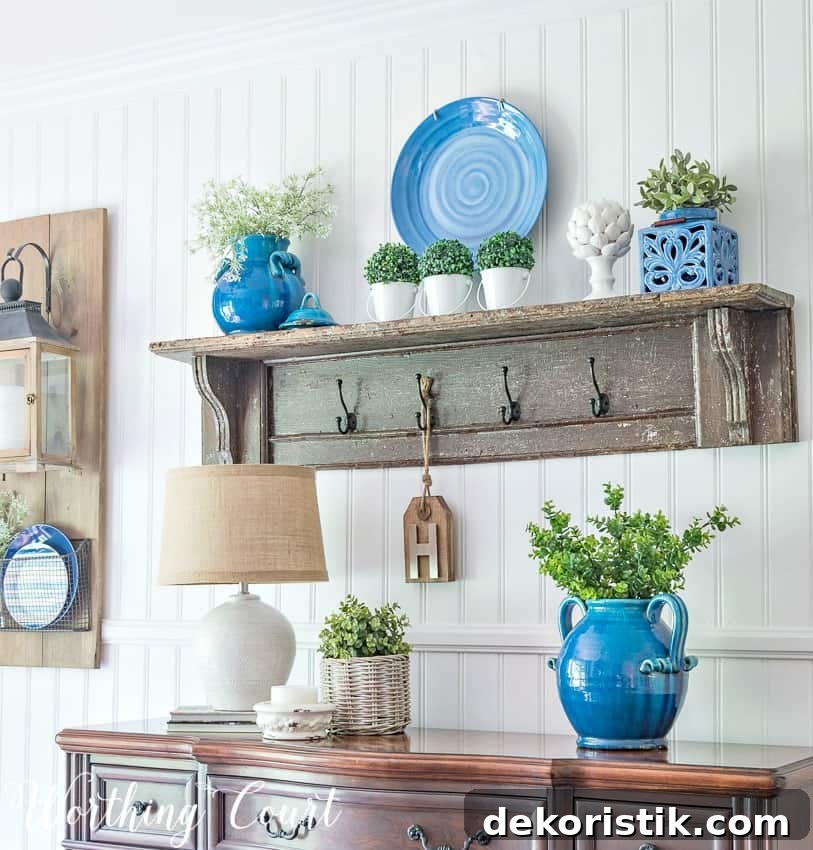 Summer sideboard and wooden vintage shelf vignette with pops of blue.