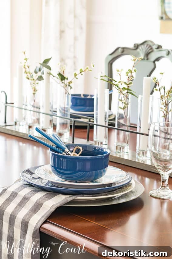 An up close look at the blue dishes and napkin on the dining room table.