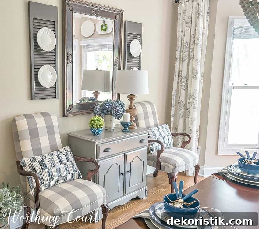 There are two armchairs in grey and white just off the dining room.