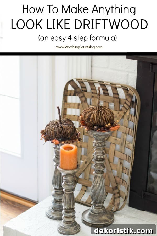 three gray candlesticks on a white brick hearth