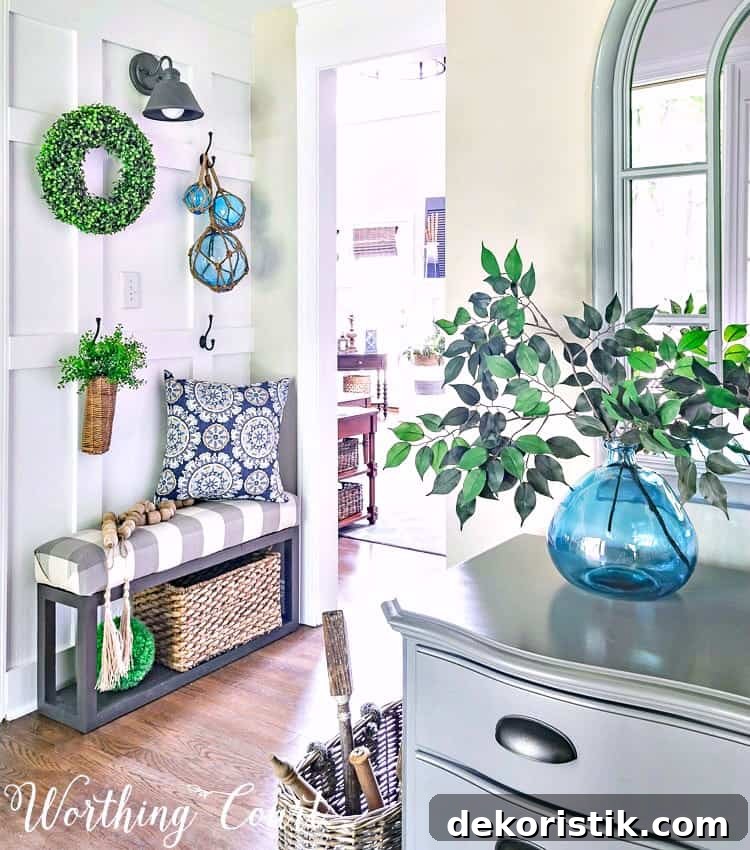 Farmhouse style board and batten foyer wall decorated for summer with turquoise and green || Worthing Court