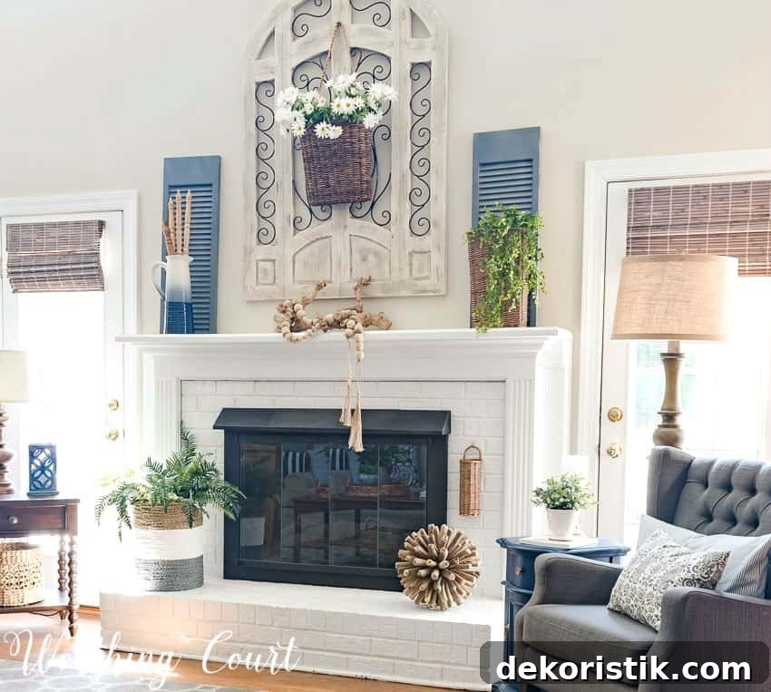 Painted red brick fireplace decorated for summer with simple organic elements || Worthing Court