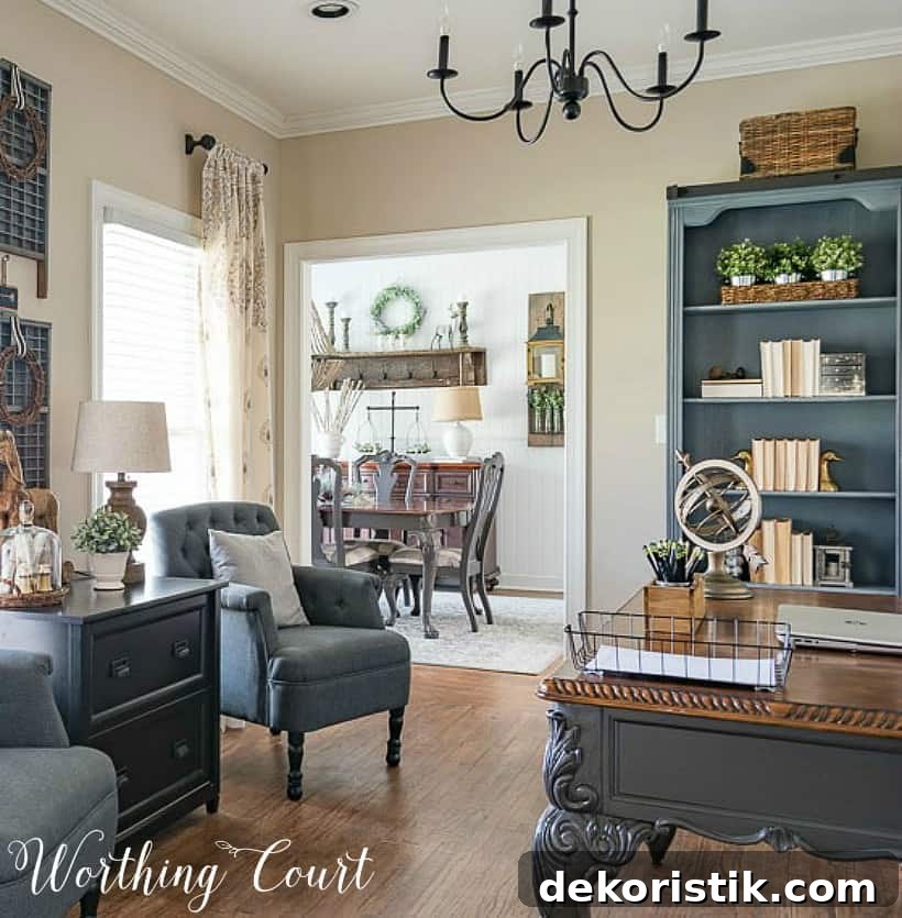 Home office with gray chairs, gray bookcases and desk.