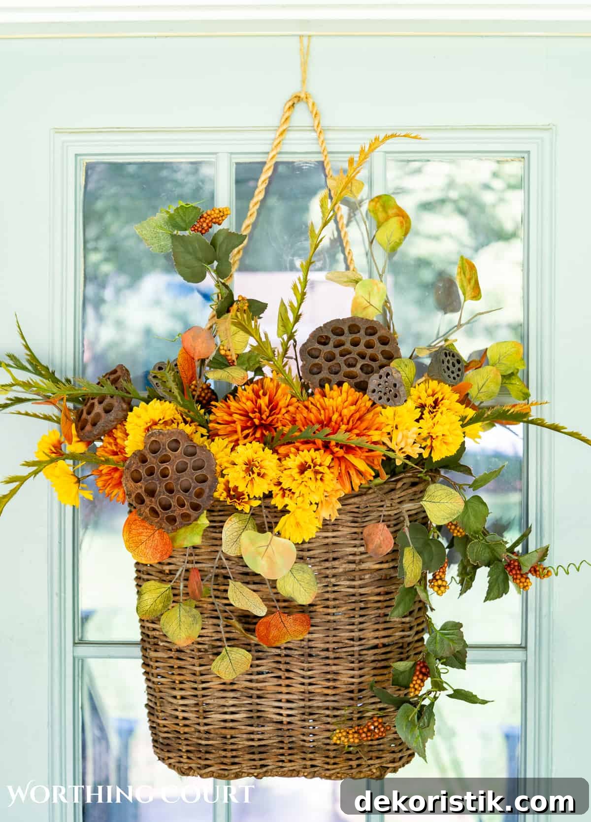 hanging door basket filled with fall foliage