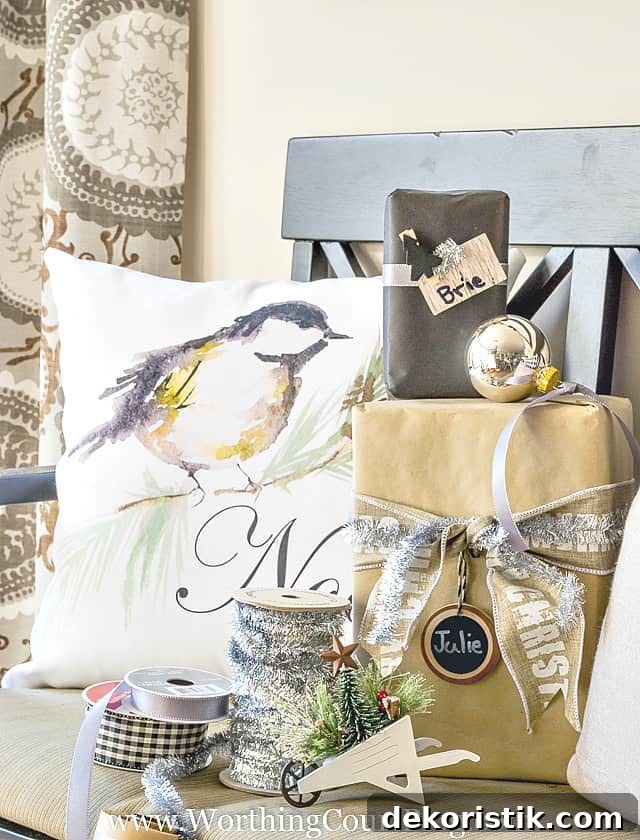Rustic Meets Glam: Stylish Christmas Decor Ideas 3 A chair filled with wrapped presents and ribbon for wrapping.