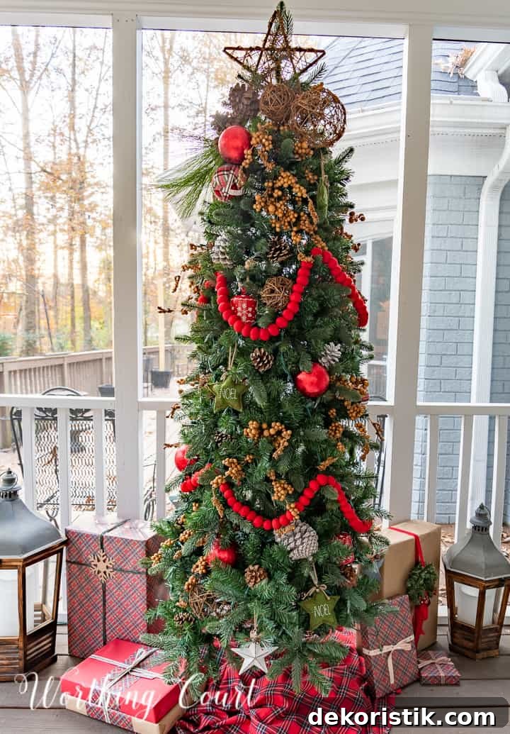 skinny Christmas tree on a screen porch decorated with outdoor type ornaments