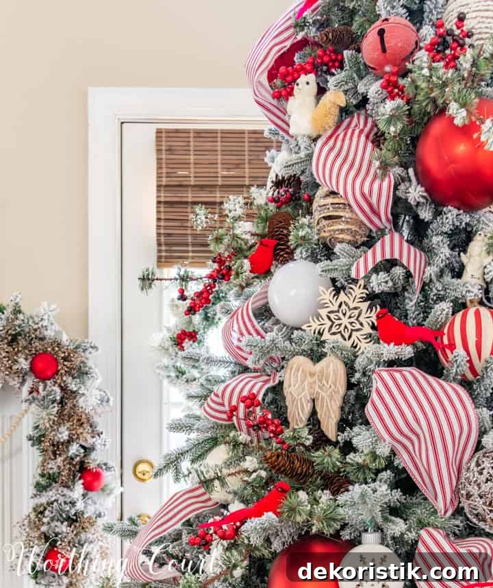partial view of Christmas tree with red and white decorations