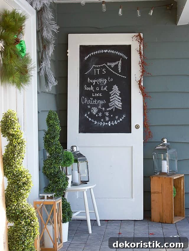 There is a white door with chalkboard beside the front door on the porch.