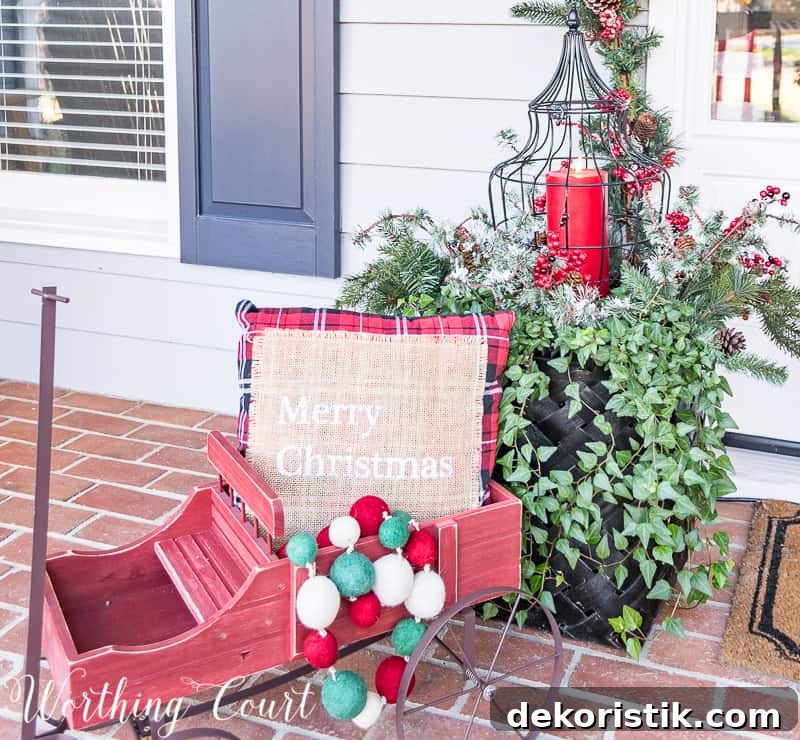 Christmas outdoor container filled with a pillow and christmas baubles.