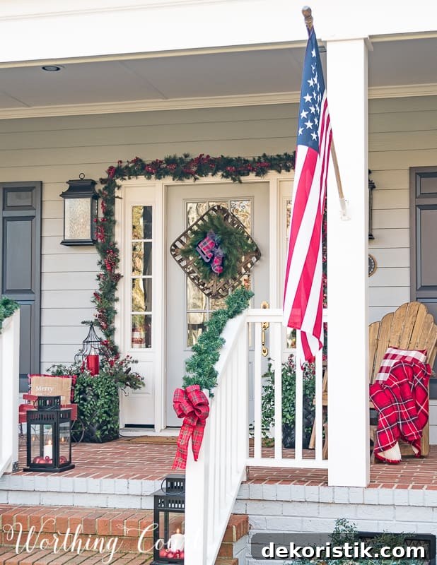 An American flag is on the front of the porch.