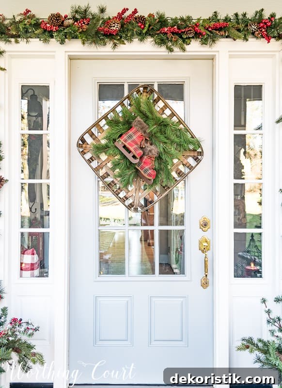 Christmas wreath created with a tobacco basket, greenery and a pair of plaid ice skates #christmas #christmaswreath #christmas decor.