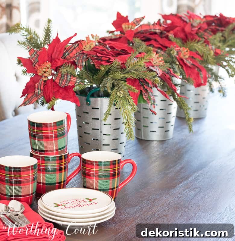 Simple Christmas centerpiece with faux poinsettias in galvanized buckets #christmas #christmascenterpiece #poinsettias #plaid