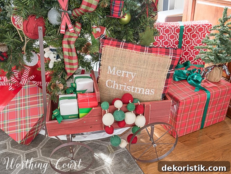 Small wagon under a Christmas tree makes a cute holder for wrapped gifts #Christmasdecor