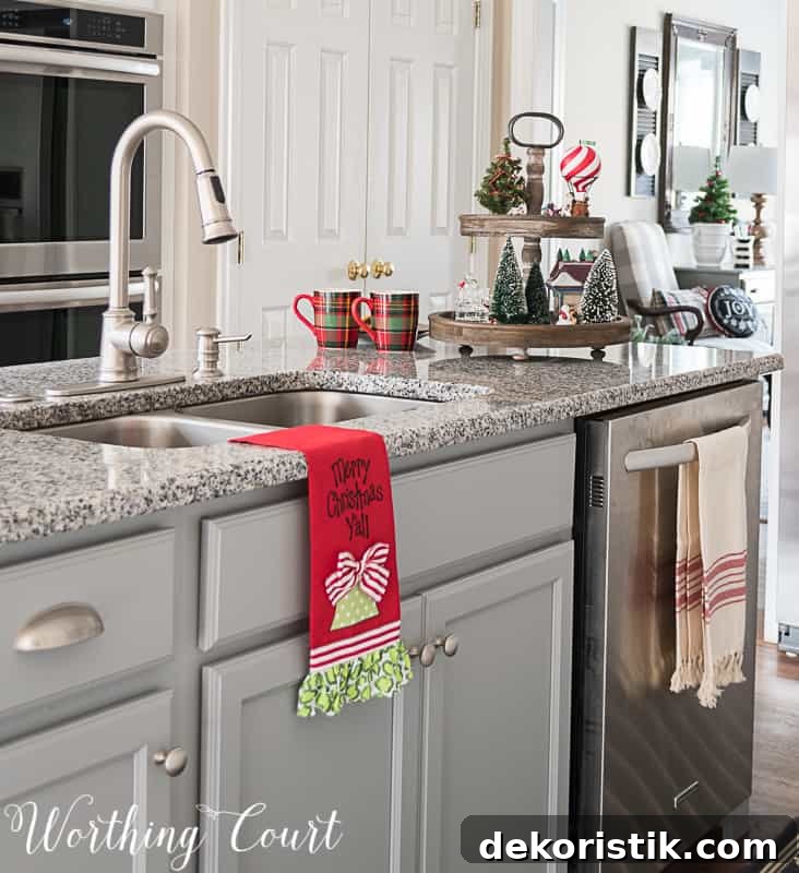 Merry Christmas Y'all kitchen towel on the sink.