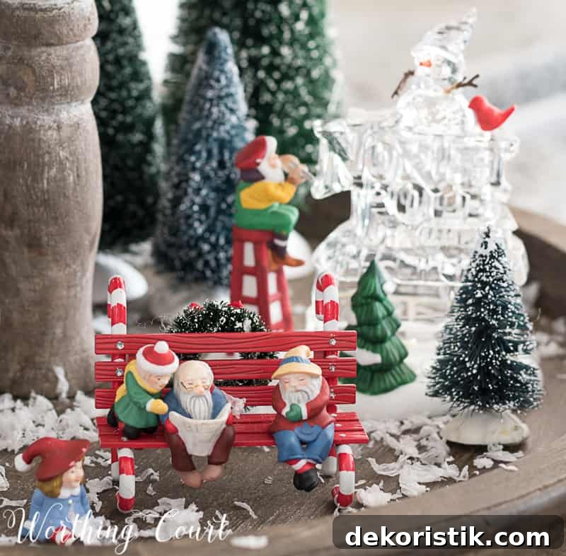 Christmas snow village on a farmhouse wooden two tiered tray.