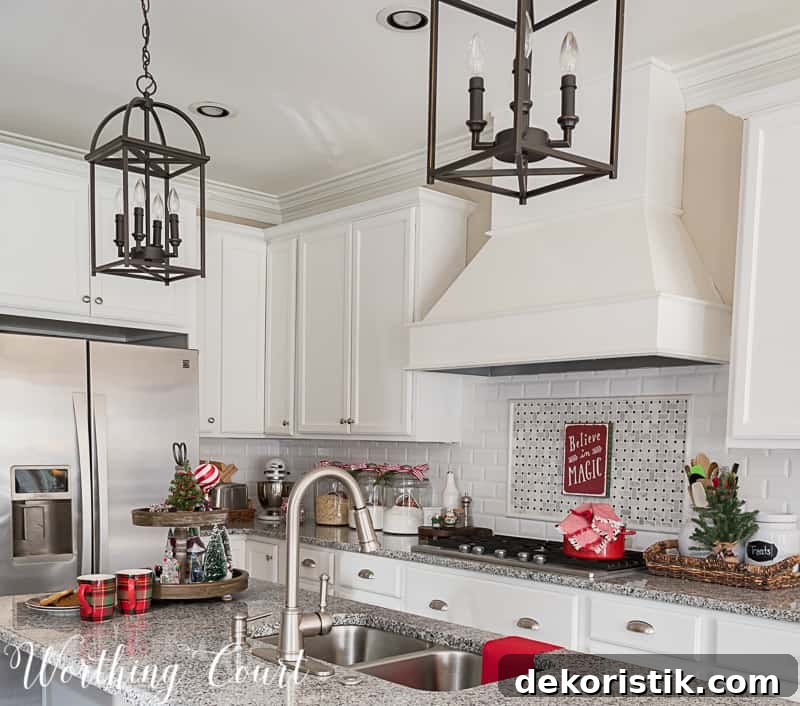 Farmhouse kitchen with white cabinets decorated for Christmas.