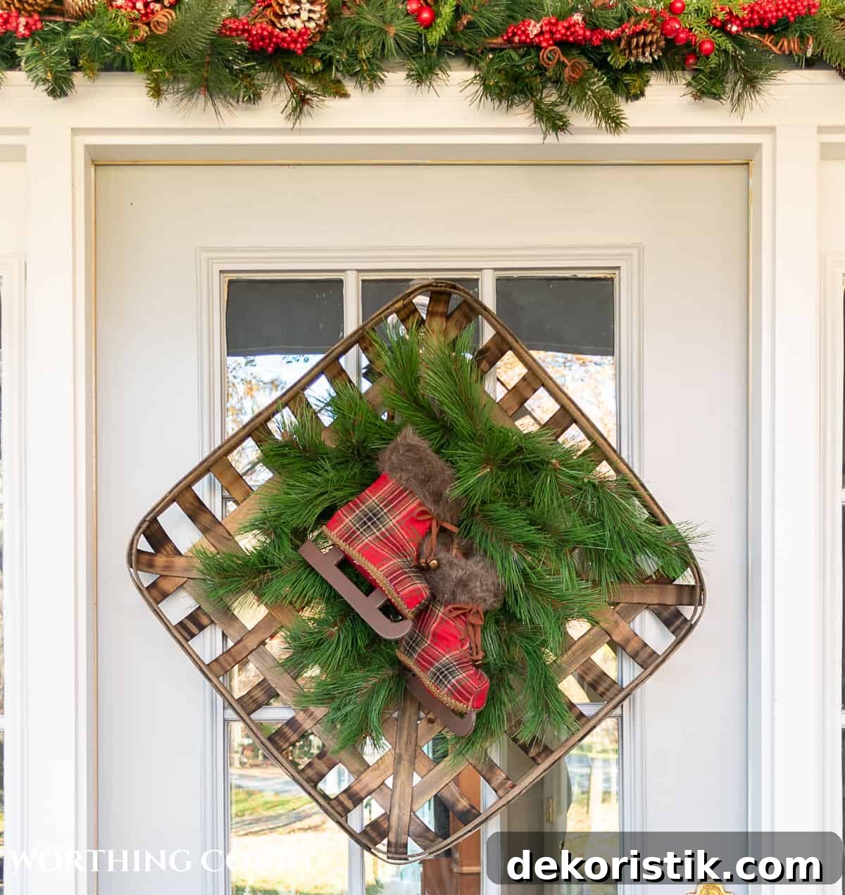 square tobacco basket and faux pine picks on a front door being used as a Christmas wreath