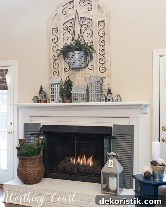 Painted brick fireplace, winter decorations, winter mantel and a small village on the mantel.