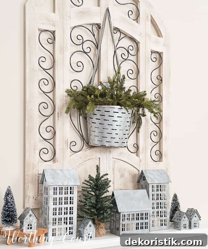 galvanized metal container, olive bucket, winter decor on the fireplace mantel.