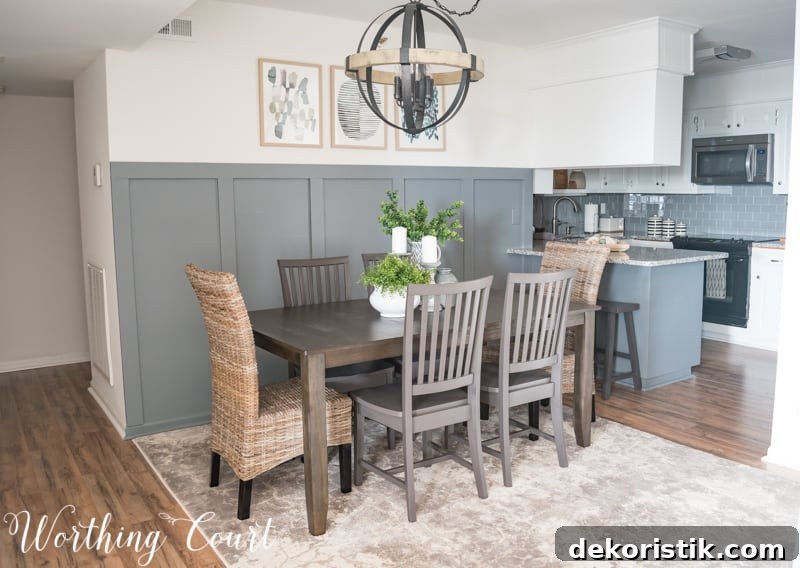 Modern farmhouse dining room, statement chandelier, orb chandelier, rustic industrial, board and batten, abstract art
