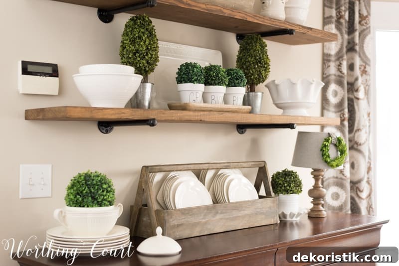 Spring decorating ideas for shelves with topiaries and white plates.