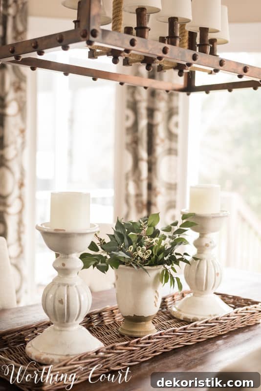 White candlesticks and pottery for the dining room centerpiece.