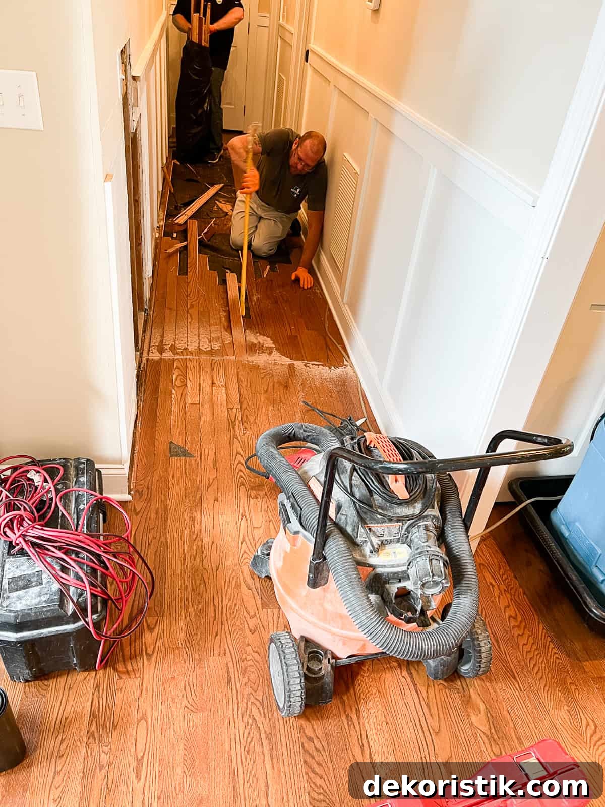 Narrow Hallway Decor Ideas to Maximize Space 5 men working in a hallway where there was a waterleak