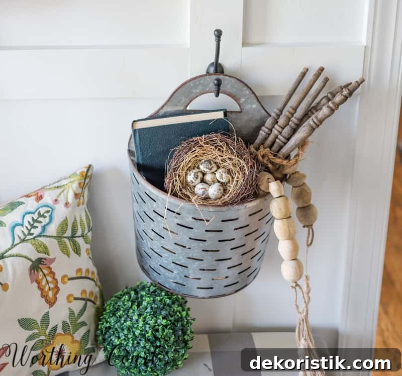 Entryway Makeover Reveal: DIY Ideas Using What You Have 20 A rustic tin basket is filled with decor items.