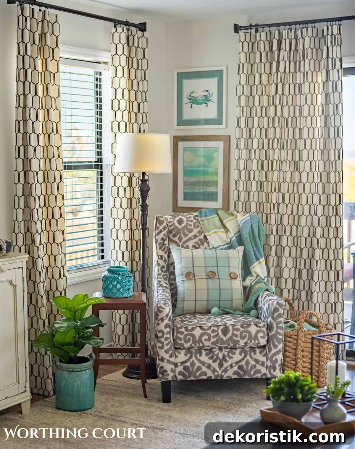 DIY Lined Curtain Panels: Step-by-Step Sewing Guide 26 gray and white arm chair in corner in front of windows with neutral curtains with lining and with blue and aqua pillow and coastal art above