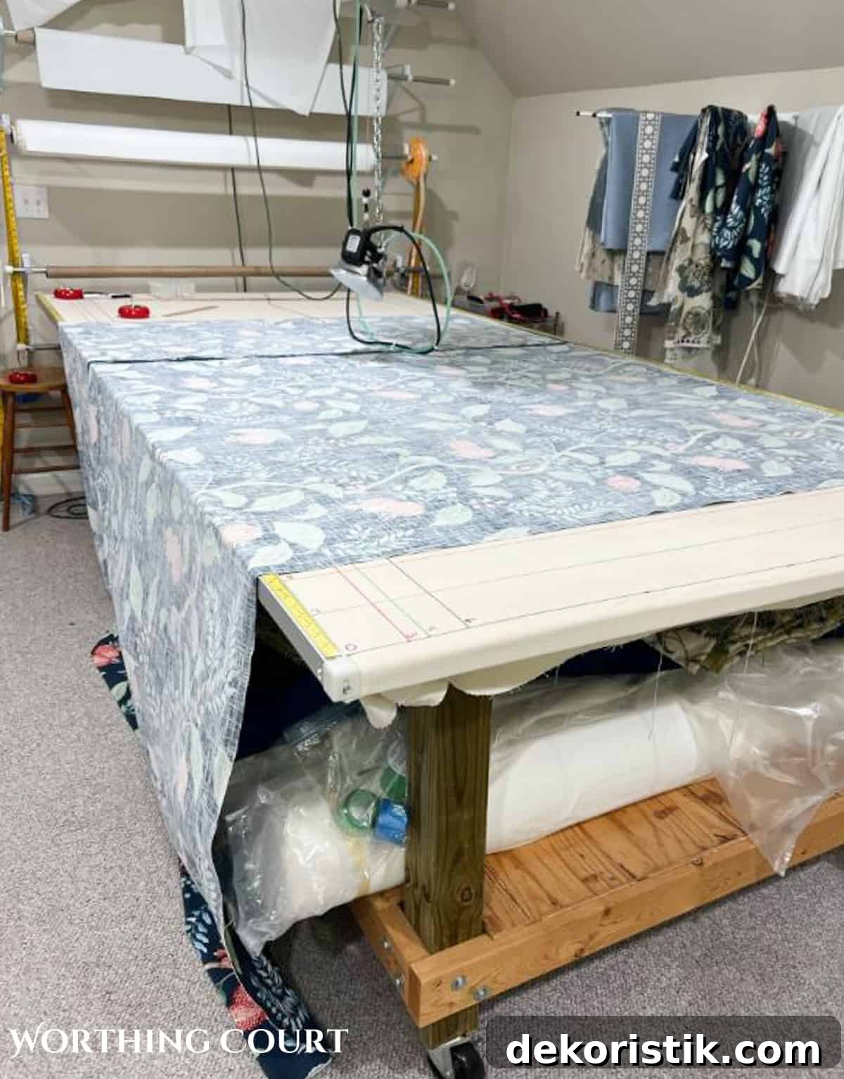 DIY Lined Curtain Panels: Step-by-Step Sewing Guide 4 fabric for draperies being prepped to add lining on a workroom table