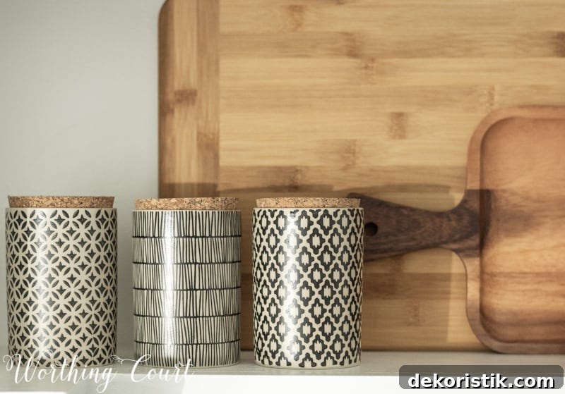 Transform Your Kitchen Without Remodeling: Before and After 14 Pretty decorative containers on the counter.