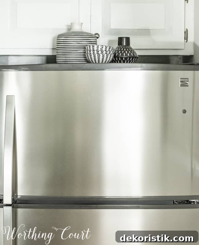 Transform Your Kitchen Without Remodeling: Before and After 15 Bowls and containers on top of the fridge.