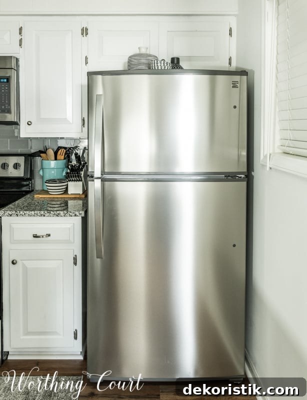 Transform Your Kitchen Without Remodeling: Before and After 10 The stainless steel fridge in the kitchen.