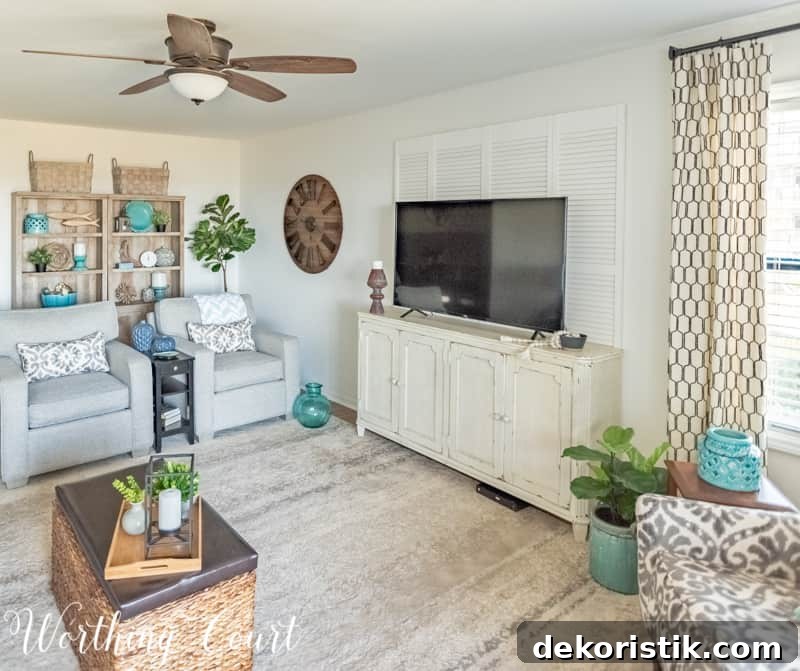 Mounted bi-fold doors behind TV for texture