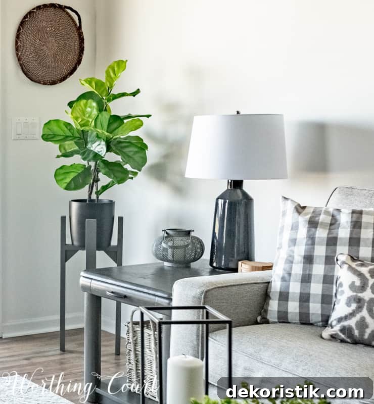 Faux fiddle fig on plant stand with woven wall basket