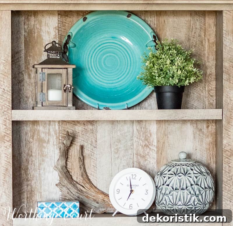 Bookcase styling with coastal accents