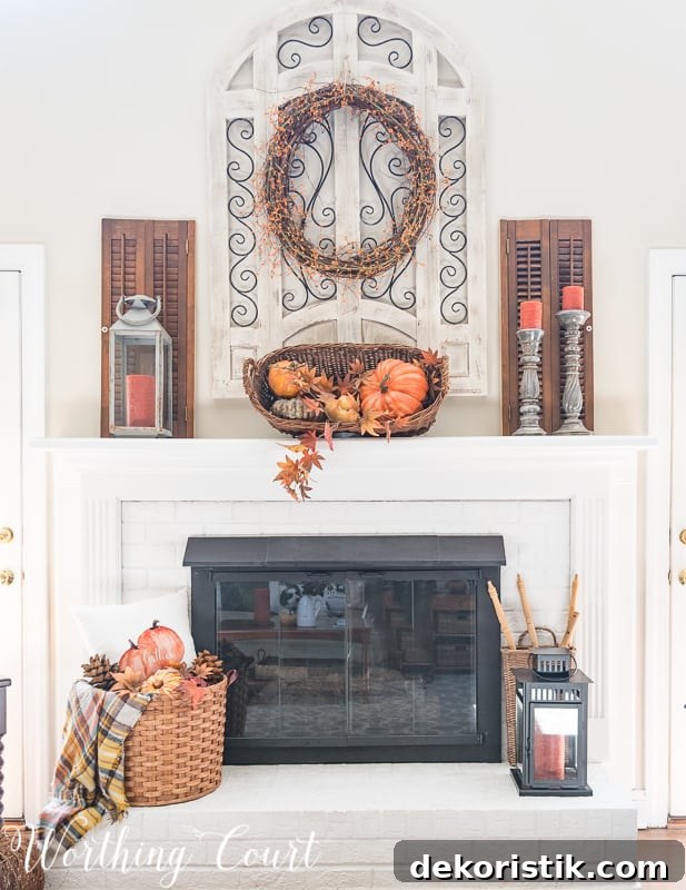 Fireplace decorated for fall with baskets and pumpkins